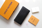 Small Louis Vuitton black textured cardholder, vertical with embossed LV logo