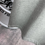 Heather gray T-shirt hem and sleeve cuff close-up.