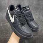 Black Nike Air Force 1 style sneakers with white Swoosh and lace-up uppers