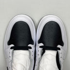 White high-top sneakers with black interior lining, lace-up eyelets, and perforated toe