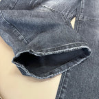 Dark wash denim jeans cuff with frayed hem opening