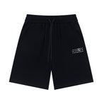 Black drawstring shorts with elastic waistband and side pockets