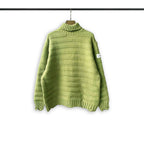 Turtleneck knit sweater in bright green with ribbed collar and stepped hem