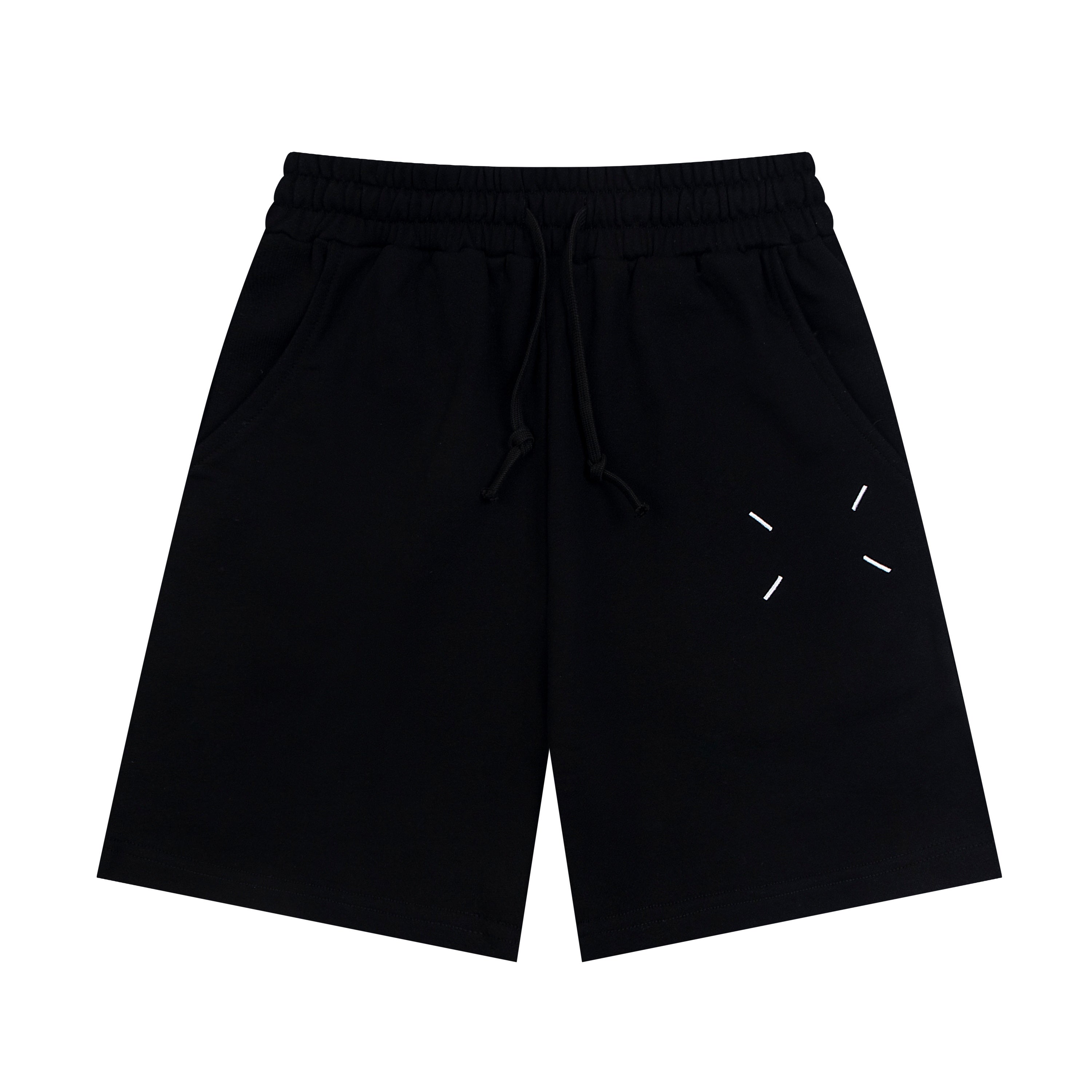 Black Maison Margiela shorts with elastic waist, drawstring, and dash line graphic.