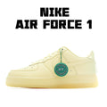 Air Force 1 low-top sneaker in pale yellow leather with green HY tag and white swoosh
