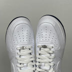 White Nike Air Force 1 toe view with perforations and lace-up closure