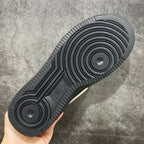Black sneaker outsole with circular traction pods and ribbed herringbone tread