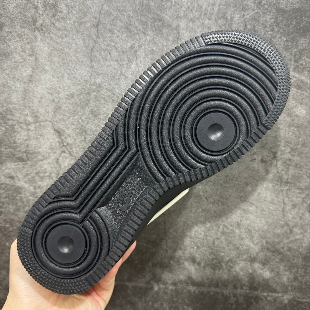 Black sneaker outsole with circular traction pods and ribbed herringbone tread