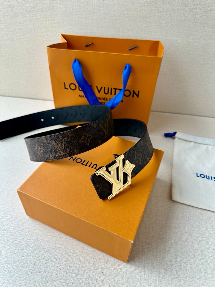 Louis Vuitton monogram belt with dark strap and gold-tone LV buckle, coiled