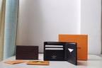 Black Louis Vuitton small bag wallet open to card slots and interior pocket