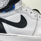 Close-up of white high-top sneakers with black Nike Swoosh and textured stitching