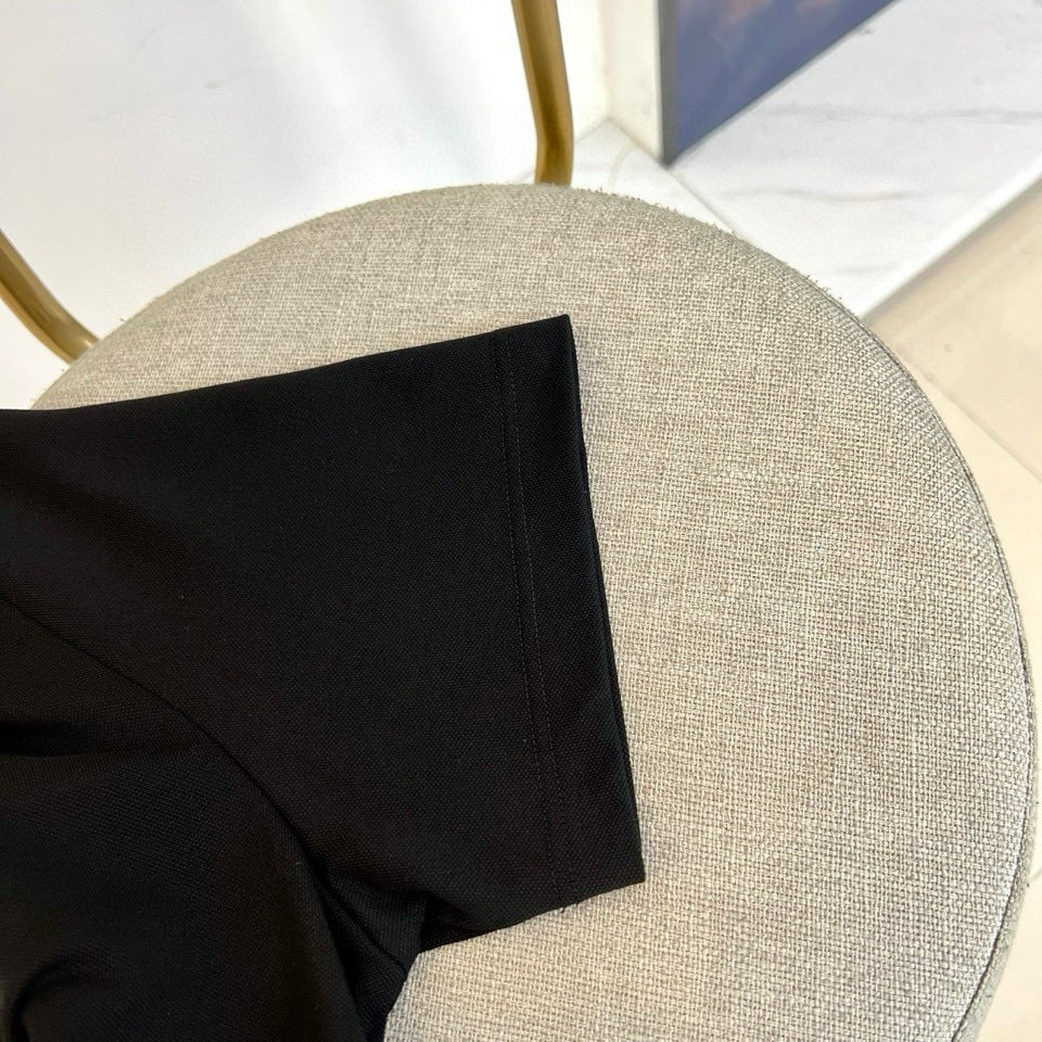Burberry polo shirt close-up of collar edge and shoulder seam in dark fabric