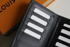 Louis Vuitton small wallet interior close-up with card slots in black leather