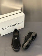 Black loafers slip-on style with square logo detail and chunky sole, top view