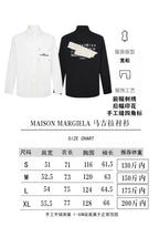 White and dark navy button-up shirts with Maison Margiela printed logos