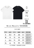 Short-sleeve T-shirt in white and black with number graphic; size chart shown.
