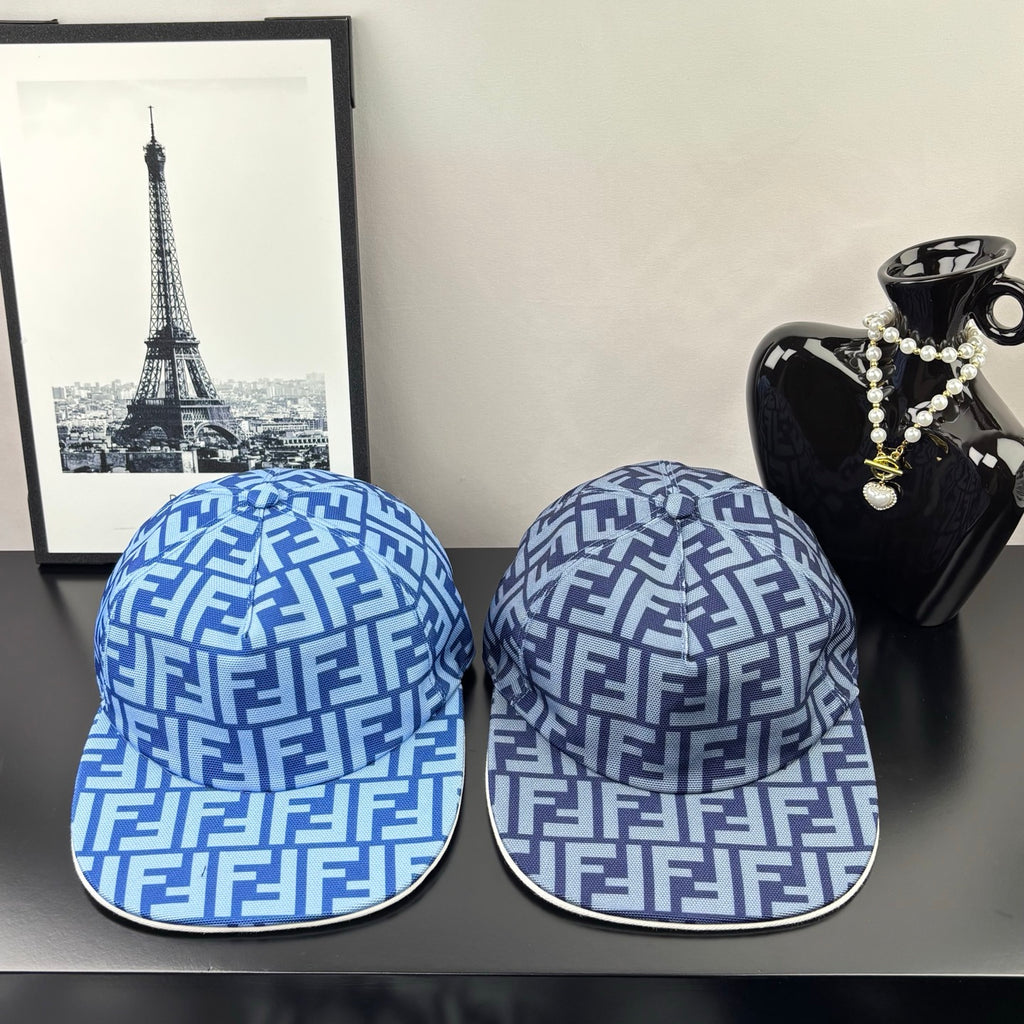 Two Fendi caps in blue with white FF monogram pattern, front view