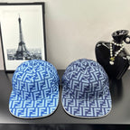 Two Fendi caps in blue with white FF monogram pattern, front view