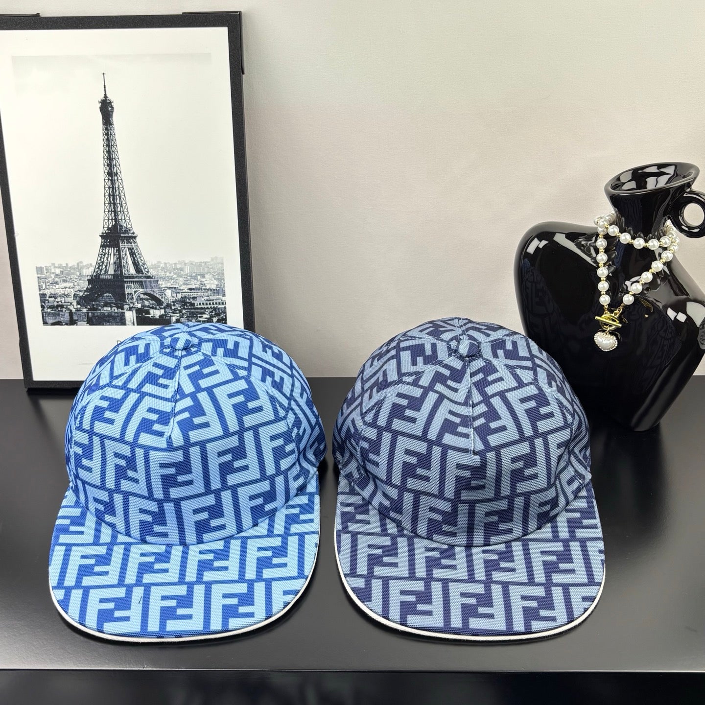 Pair of Fendi caps with blue and white FF monogram pattern and curved brim