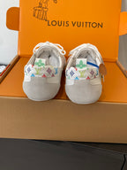 Two white unisex sneakers with multicolor logo trim at the heel and lace-up tops