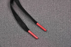 Black sneaker laces with red tips