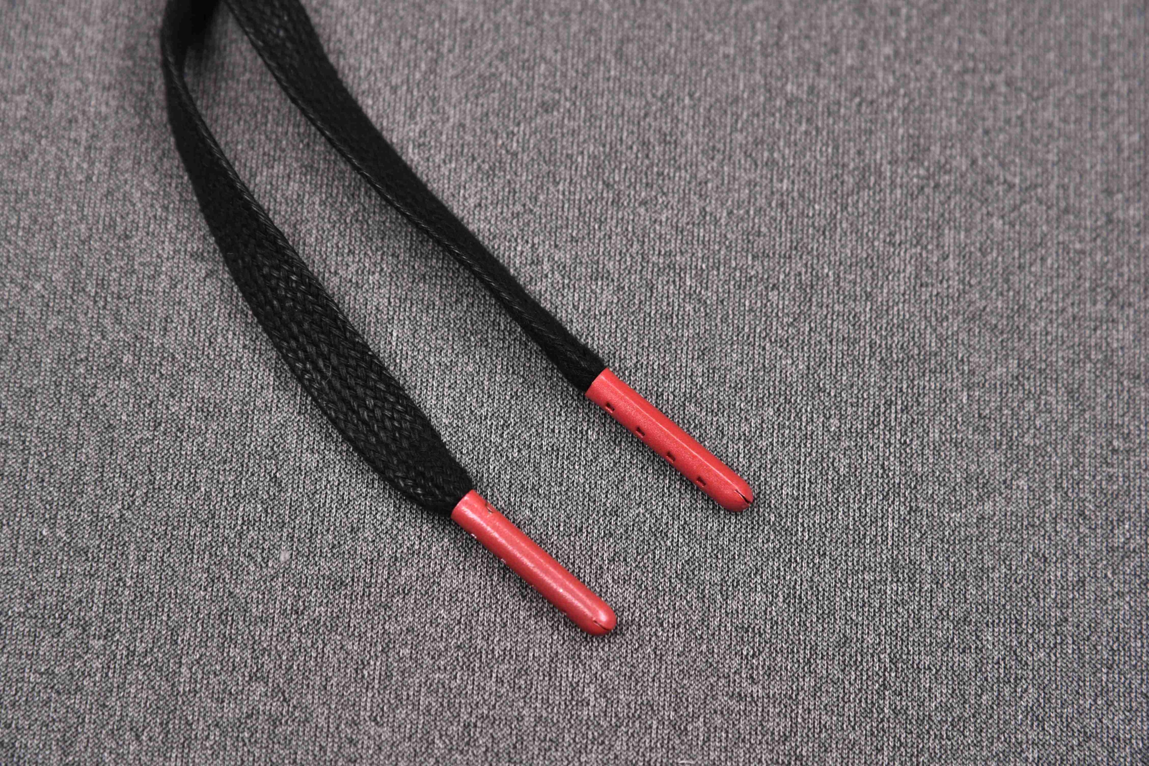 Black sneaker laces with red tips