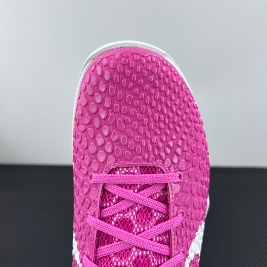 Pink sneaker outsole with lace-up opening detail and textured rubber tread