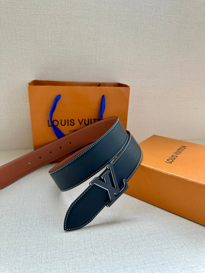 Louis Vuitton belt, dark blue leather with silver LV buckle and tan reverse side
