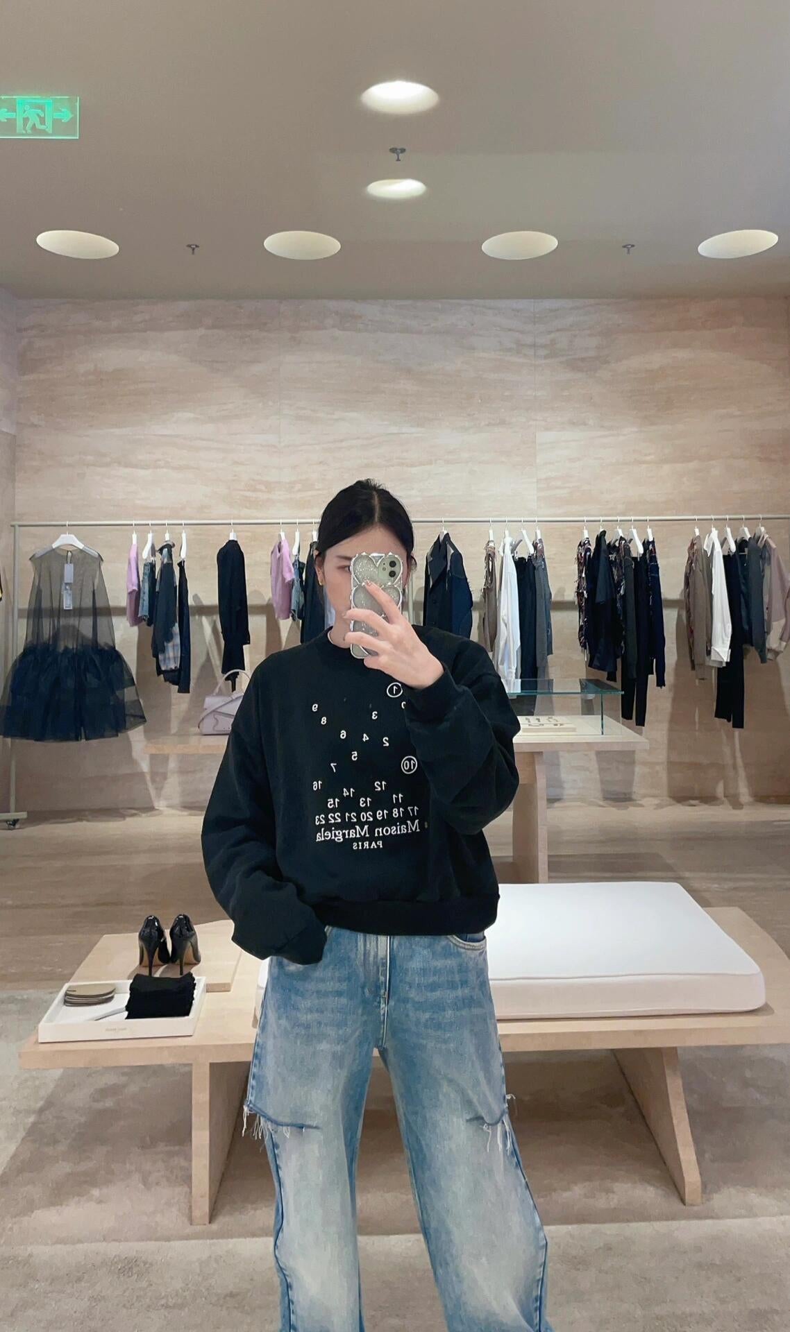 Black Maison Margiela sweatshirt with long sleeves and numeric logo graphic