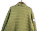 Bright green turtleneck knit sweater with ribbed collar and horizontal knit lines