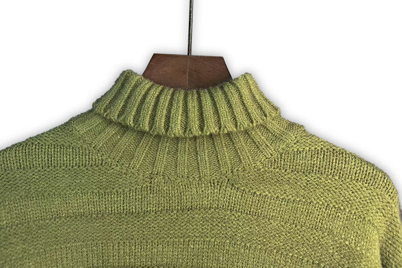 Bright green knit turtleneck with ribbed collar and seamless ribbed panel lines