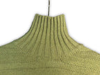 Bright green turtleneck knit sweater, close-up of ribbed collar and knit texture