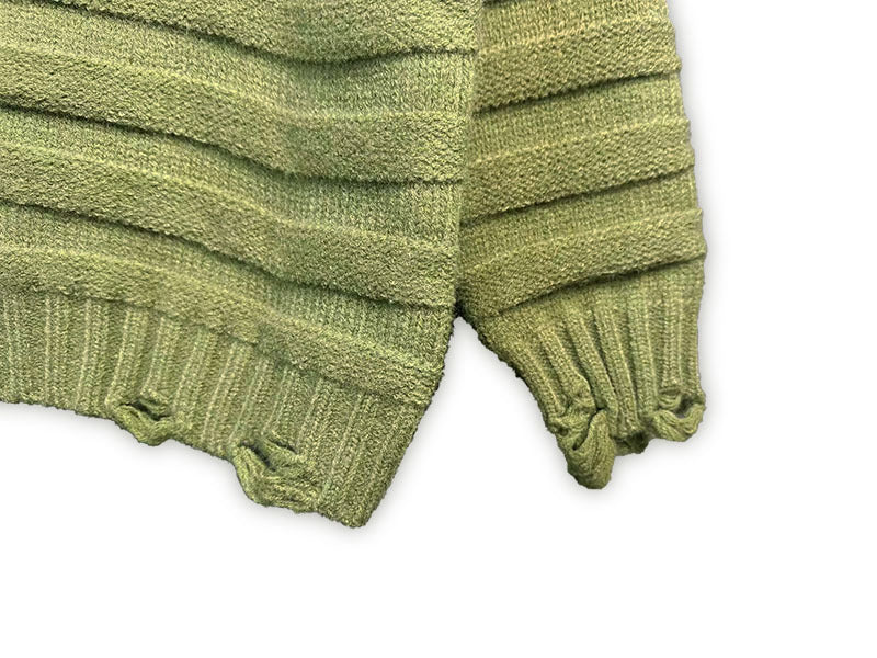 Bright green knit sweater cuffs with ribbed trim and frayed knit edges