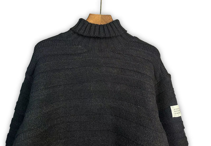 Dark charcoal knit turtleneck sweater with ribbed collar