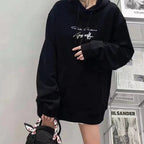 Black Maison Margiela hoodie, model wearing with hood and logo chest print