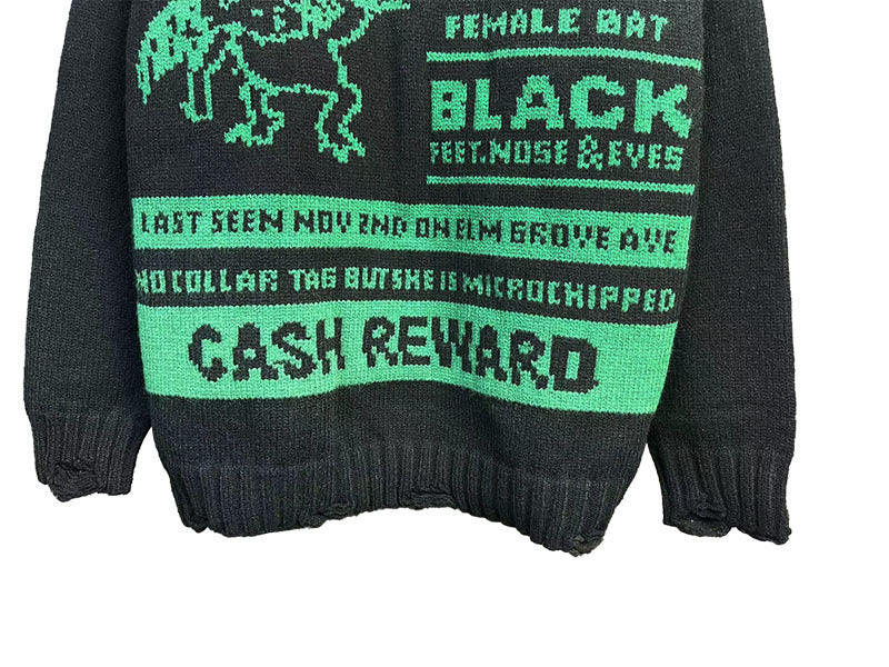 Dark crewneck sweatshirt close-up with “BLACK” panel and “CASH REWARD” text