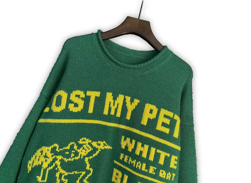 Green knit sweater with crew neck and “LOST MY PET?” print