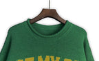 Green knit sweater with ribbed crew neck collar