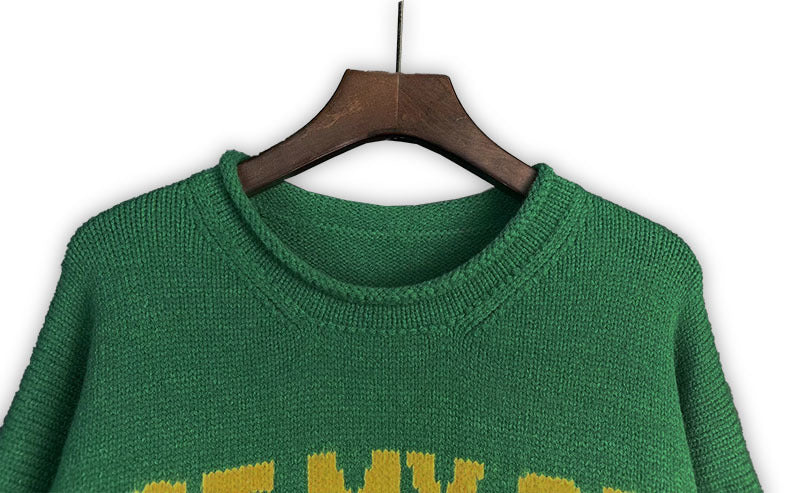 Green knit sweater with ribbed crew neck collar