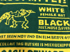 Green knit sweater with yellow dog graphic and “WHITE”/“BLACK” text