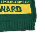 Green knit sweater closeup with yellow stripe and ribbed cuff hem