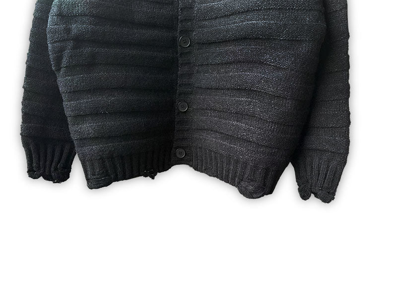 Maison Margiela dark knit cardigan close-up with button front and ribbed hem