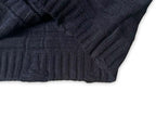 Maison Margiela dark knit cardigan close-up of ribbed cuff and side knit texture