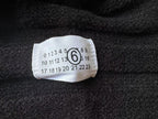 Button-front knit fabric with size label attached