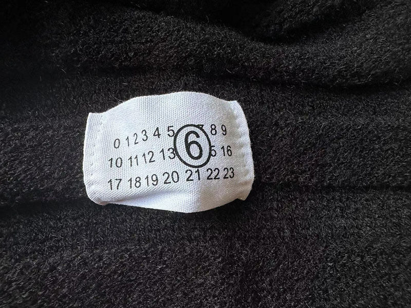 Button-front knit fabric with size label attached