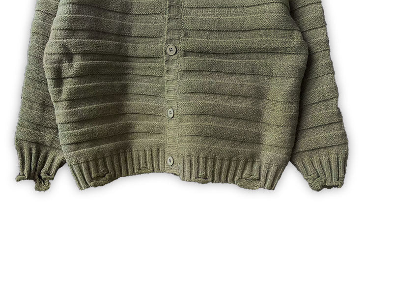 Olive green knit cardigan front with button closures and ribbed hem