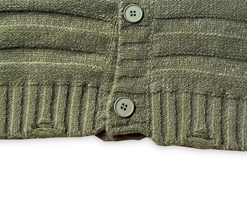Olive green knit cardigan placket with two buttons and ribbed detailing