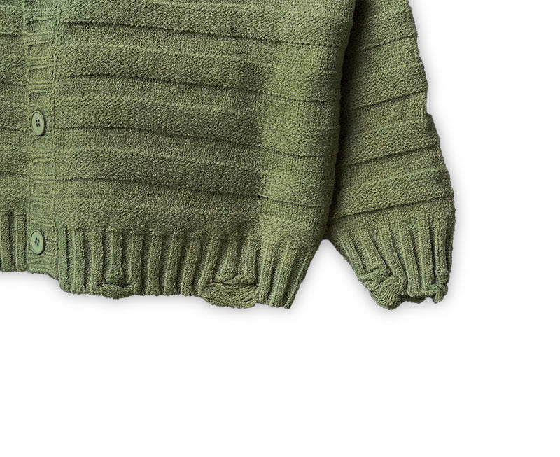 Olive green knit cardigan lower front with ribbed hem and cuffs