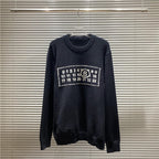 Navy crewneck knit sweater with rectangular number graphic on the chest