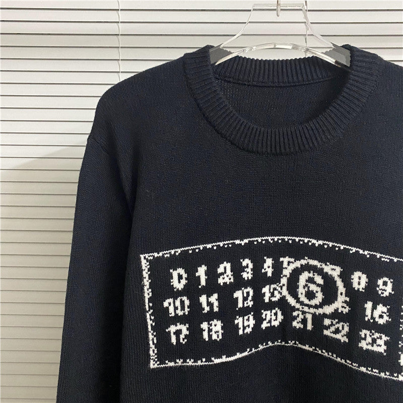 Navy knit sweater with ribbed crew neck and white graphic number logo across chest